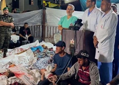 کادر درمان بیمارستان المعمدانی در میان اجساد غزه