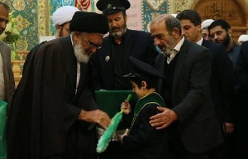  عکس/حکم خادمی به فرزند شهید مدافع حرم